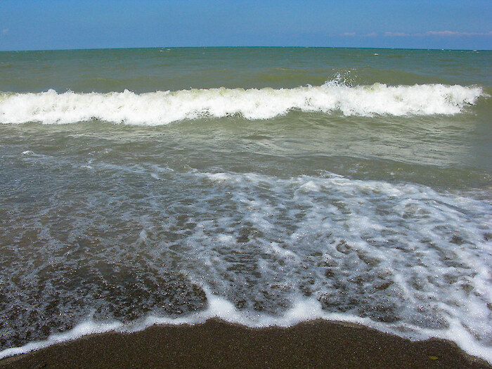 Surf in Lake Erie is clouded by suspended solids in the water. Photo by Janet Moore-Coll via Flickr, CC BY-NC-ND
