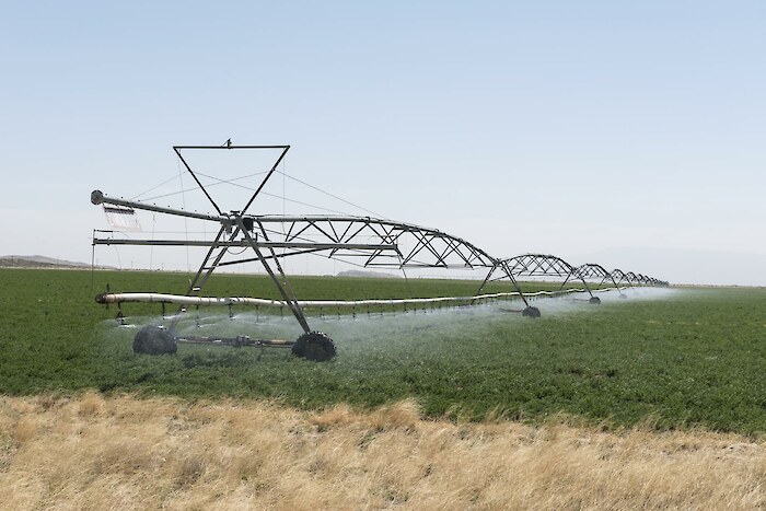 Rolling irrigation sprinkler at work along the road carrying U.S. Highways 62-180 near the New Mexico border in Hudspeth County, Texas, by Carol Highsmith, via Library of Congress.