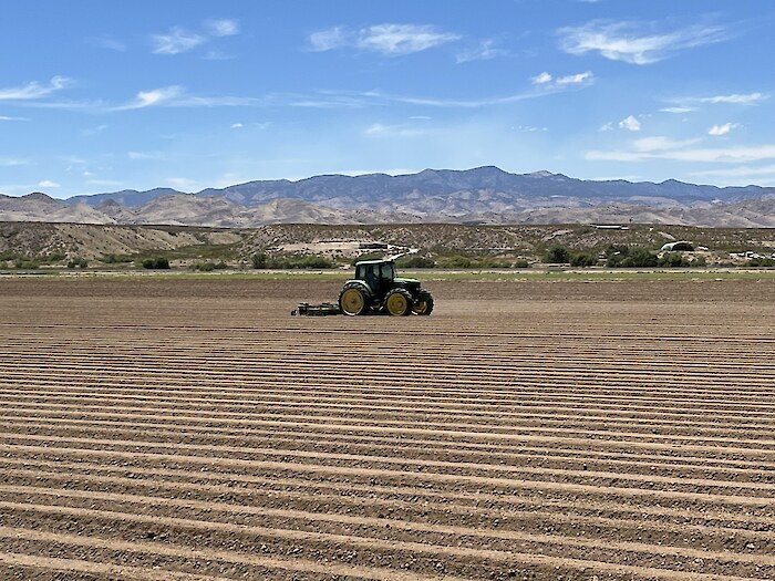 Laser leveling and GPS guided tractors reduce irrigation losses in the Middle Rio Grande Conservancy District, by Enrique Prunes.