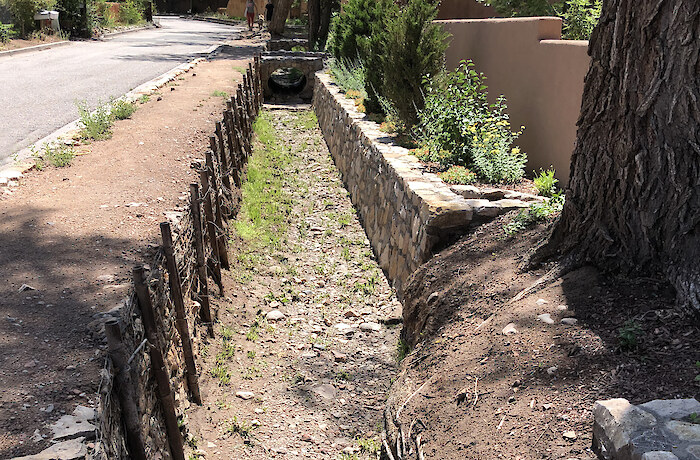 Acequia Madre (Mother Ditch) Santa Fe, New Mexico, June 2022, in the Monte del Sol neighborhood, via WikiMedia Commons.