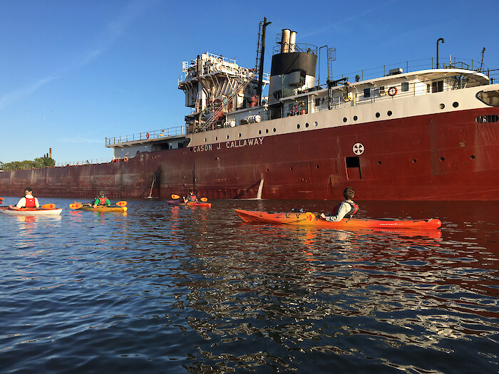 Kayakers paddle past the Cason J. Callaway cargo ship on the Rouge River. Photo credit: Friends of the Rouge River.